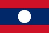 The flag consists of three horizontal strips, middle blue strip is twice the height of the top and bottom red stripes. In the center is a white disk symbolizing the unity of the people under the leadership of the Lao People's Revolutionary Party and the country's bright future. It is also said to represent a full moon against the Mekong River. The red stripes stand for the blood shed by the people in their struggle for freedom, and the blue symbolizes their prosperity.