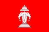 From 1952 until the fall of the royal government in 1975 the country had a red flag, with a white three-headed elephant (the god Erawan) in the middle. On top of the elephant is a nine-folded umbrella, while the elephant itself stands on a five-level pedestal. The white elephant is a common royal symbol in Southeast Asia, the three heads referred to the three former kingdoms Vientiane, Luangprabang, and Champasak which made up the country. The nine-folded umbrella is also a royal symbol, originating from Mt. Meru in the Buddhist cosmology. The pedestal represented the law on which the country rested.