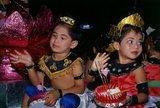 Children in traditional clothes ready to float their krathongs, Loy Krathong Festival, Phuket, Southern Thailand. Loy Krathong is held annually on the full moon night of the 12th month in the traditional Thai lunar calendar. In northern Thailand this coincides with the Lanna festival known as Yi Peng.