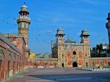 The Wazir Khan Mosque (Masjid Wazir Khan) in Lahore, Pakistan, is celebrated for its extensive faience tile work. It has been described as 'a beauty spot on the cheek of Lahore'. It was built in seven years, starting around 1634-1635 A.D., during the reign of the Mughal Emperor Shah Jehan. It was built by Shaikh Ilm-ud-din Ansari, a native of Chiniot, who rose to be the court physician to Shah Jahan and later, the Governor of Lahore. He was commonly known as Wazir Khan. The mosque is located inside the Inner City and is easiest accessed from Delhi Gate. Public Domain image by Guilhem Vellut.