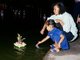 Thailand: Mother and daughter floating a krathong, Loy Krathong Festival, Chiang Mai