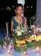 Thailand: Girl in traditional clothing with krathongs, Loy Krathong Festival, Chiang Mai