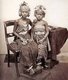 Indonesia: Two Balinese princesses in royal regalia, c. 1900.