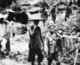 Laos: Lao and Vietnamese porters carrying supplies south along the Ho Chi Minh Trail to resupply the insurgency in the south, c. 1963.