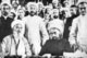 China: The Khotan Amirs: A group of Khotanlik ulama at Khotan in 1933. The Amir Muhammad Amin Bughra is centre front in black robe.
