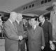 Ngo Dinh Diem, accompanied by U.S. Secretary of State John Foster Dulles, arrives at Washington National Airport in 1957. Diem is shown shaking the hand of U.S. President Dwight D. Eisenhower.