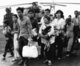 Vietnam: South Vietnamese refugees fleeing the communist conquest of Saigon in 1975 arrive at Camp Foster, Okinawa, Japan.