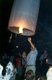 Thailand: Launching a Yi Peng hot air fire balloon (Khom Loy Fai), Loy Krathong Festival, Chiang Mai