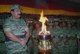 Sri Lanka: Liberation Tigers of Tamil Eelam (LTTE) leader Velupillai Prabhakaran before a flaming urn at a ceremony with female LTTE troops, c. 2006.